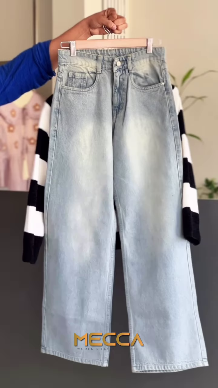Black and White Striped Knit Sweater with Light-Wash Denim - Image 2