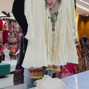 Close-Up of Ivory Crinkle-Fabric Tunic with Vibrant Floral Embroidery