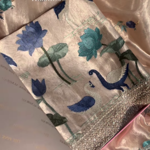 Close-Up of Exquisite Silk Fabric with Hand-Embroidered Lotus and Swan Motifs